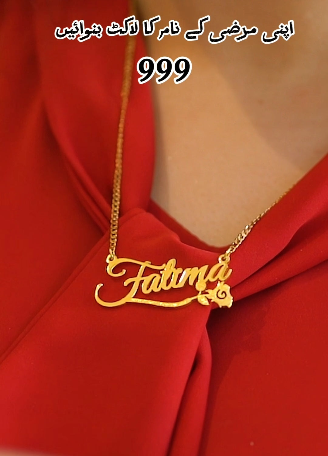 Gold necklace with 'Fatima' pendant on a red garment